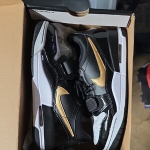 Jordan Air 1 Low Black and Yellow Sneakers